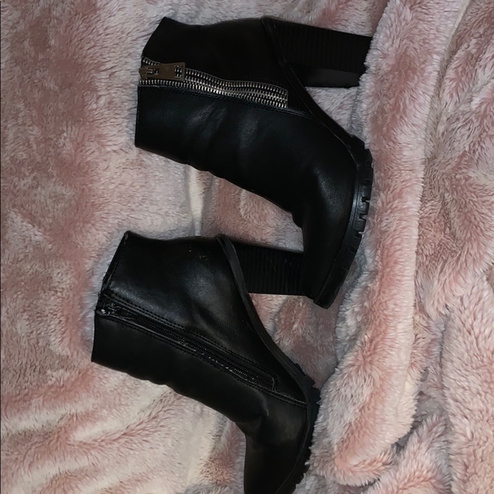 Cute black ankle boots .
